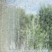 glass window pane with water stains - LoonShine Exterior Services how to remove hard water stains from home exterior windows