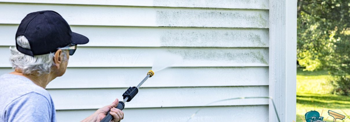 woman power washing the outside of her home - LoonShine Exterior Services safe siding cleaning methods